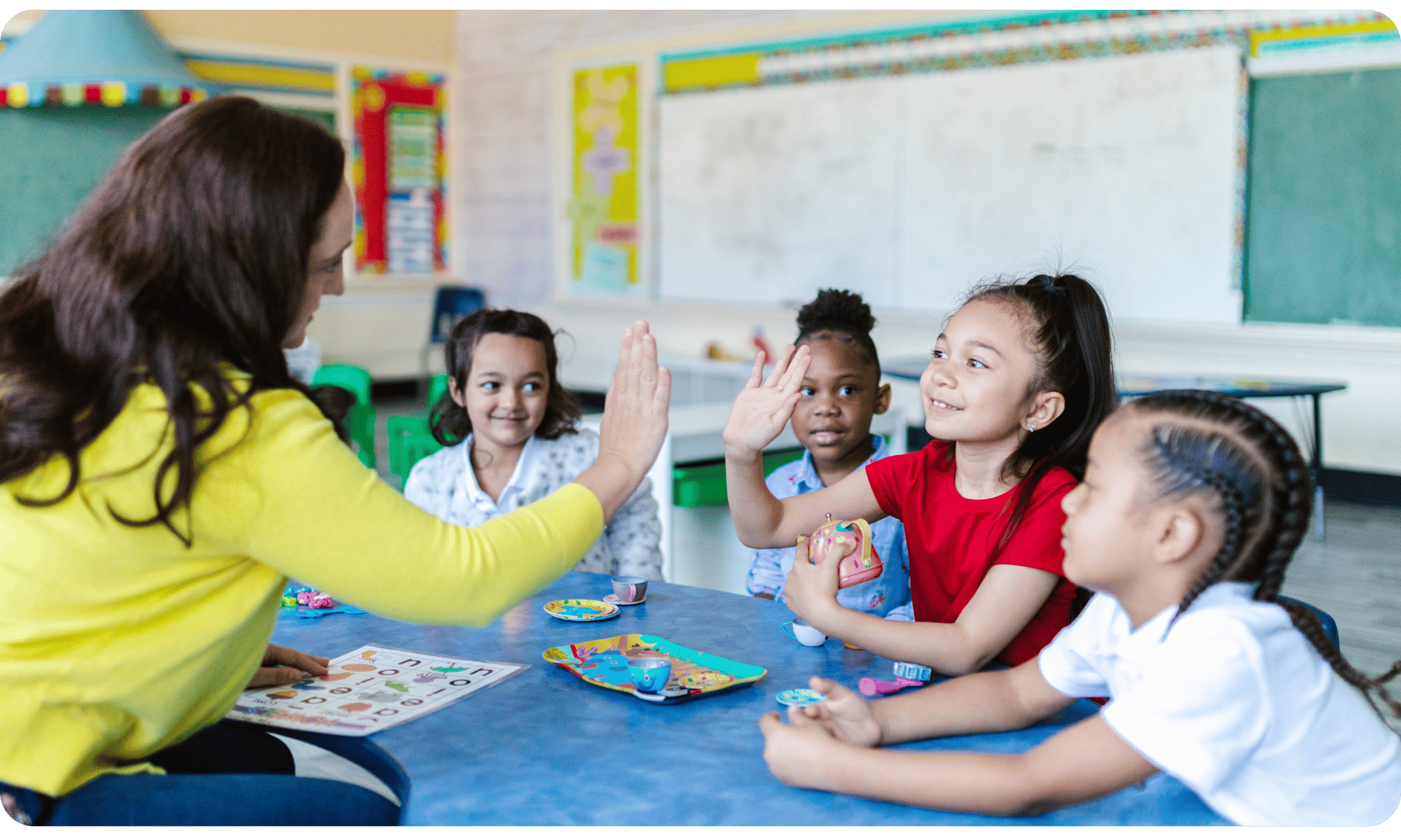 Teacher high-fiving students